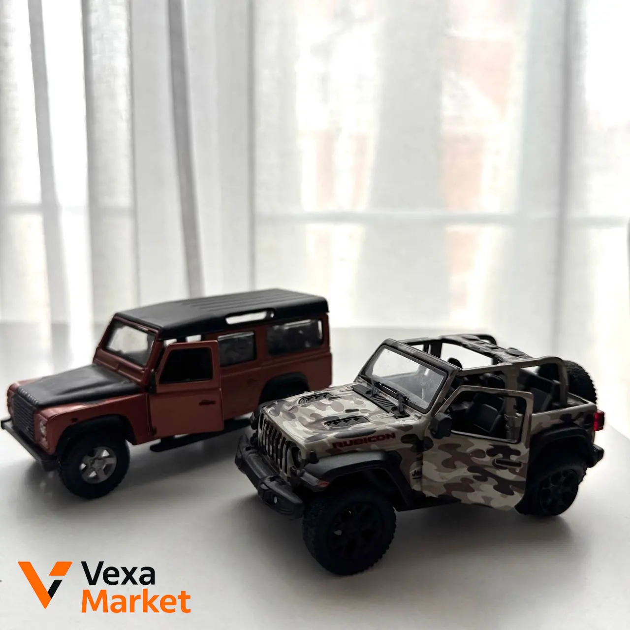 Коллекционные металлические машинки Jeep Wrangler и Land Rover Defender