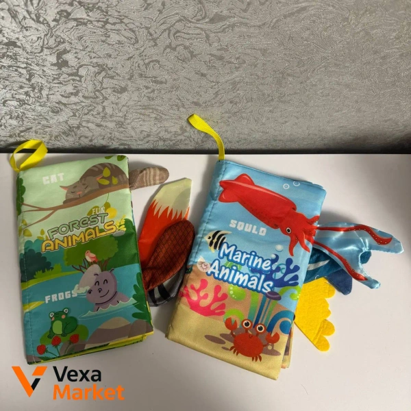 Розвиваючі іграшки для немовлят: книжечки, картки Монтессорі, брязкальця