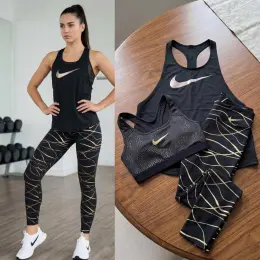 Спортивний комплект Nike жіночий топ і лосіни чорний з золотим