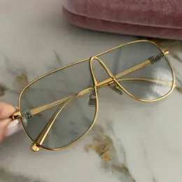 Окуляри Miu Miu золотисті