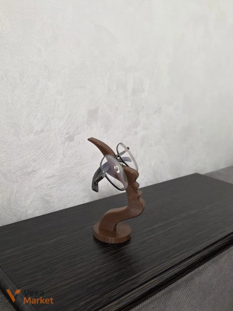 3D-печатная подставка для очков в форме абстрактного профиля лица — фото 3