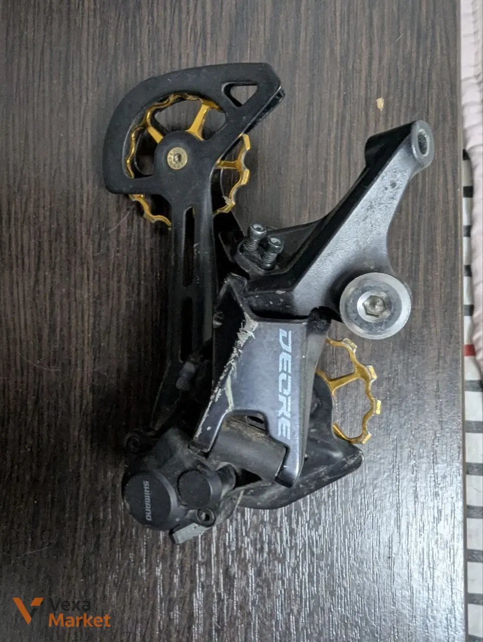 Задній перемикач Shimano Deore 12 швидкостей
