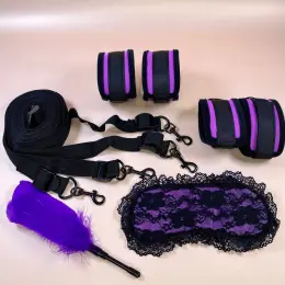Набір BDSM з фіксаторами для рук та ніг, маскою та пір'їнкою