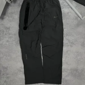 Нейлонові штани Найк Нокта (Nike Nocta)