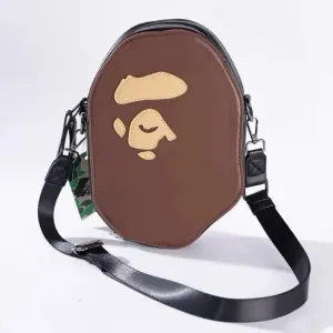 Сумка через плече Bape Ape Head Shoulder Bag у коричневому кольорі.