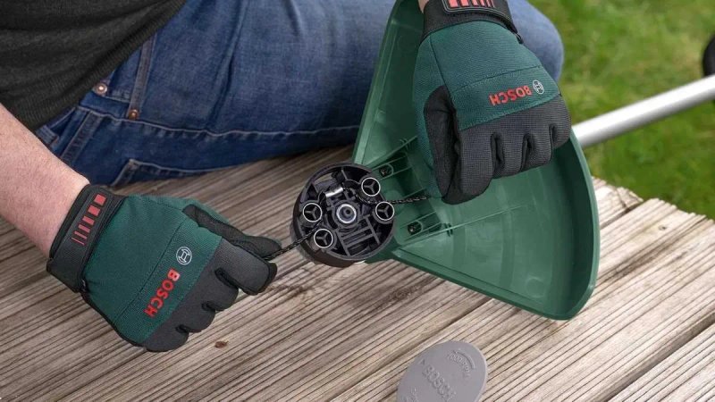 Тример електричний Bosch AFS 23-37 /1000 Вт./ 1,3 к.с/ ширина різання 23-37 см//з ножем, волосінню та ременем — фото 8