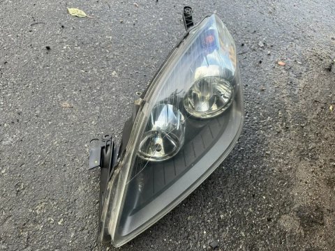 Ліва передня фара Опель Зафіра Б левая фара Opel Zafira B